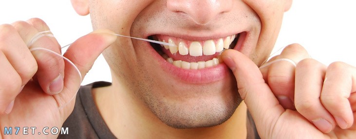 كيفية استخدام خيط الأسنان